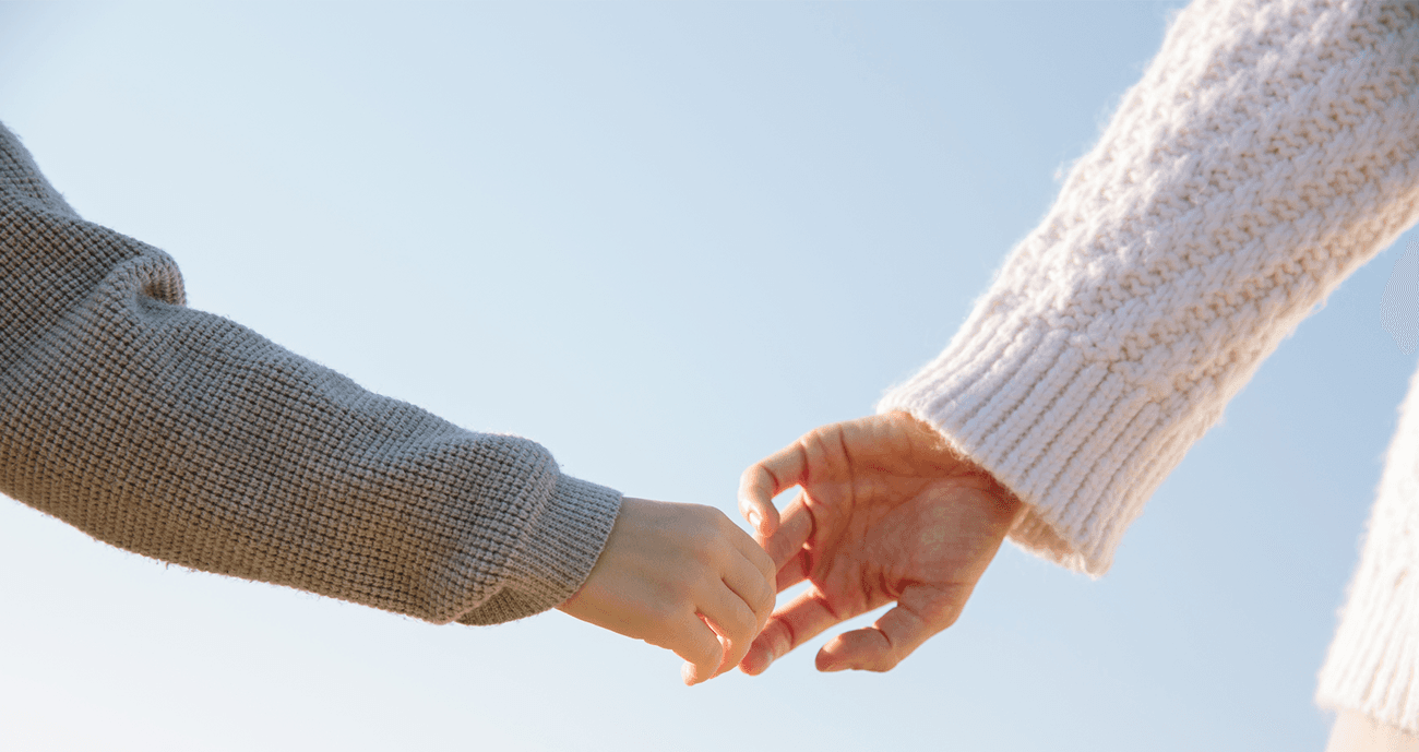 Couple letting go of each other's hand.
